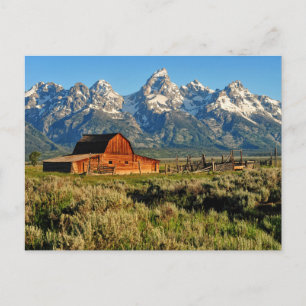 Farms   Barn Shadowed by Snow Capped Mountains Postcard