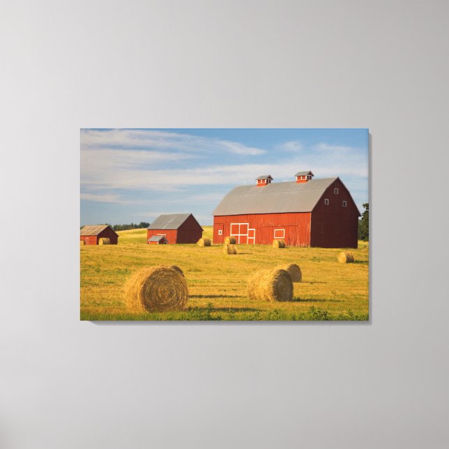 Farms | Red Barns Near Hay Bales Canvas Print (Front)