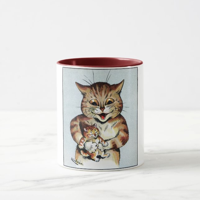 Father Cat Holding a Kitten, Louis Wain Mug (Center)