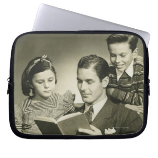 Father Reading to Son Laptop Sleeve
