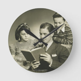 Father Reading to Son Round Clock