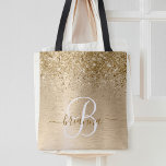 Faux Gold Brushed Metal Glitter Print Monogram Nam Tote Bag<br><div class="desc">Easily personalise this trendy chic tote bag design featuring pretty gold sparkling glitter on a gold brushed metallic background.</div>