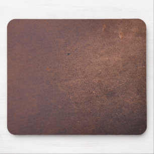 Faux leather, brown with some marks and scratches mouse mat