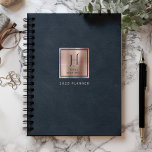 Faux Leather Navy Blue Rose Gold Monogram 2025 Planner<br><div class="desc">This elegant planner features a digital background image in imitation of navy blue leather texture. Personalise it with your monogram initial in navy blue decorative font and your name in navy blue copperplate lettering on a rose gold faux brushed metal square, along with the year or other text of your...</div>