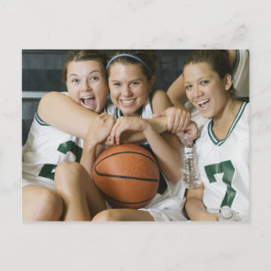 Female basketball team smiling, portrait postcard