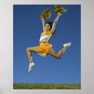 Female cheerleader jumping in air with pompoms poster