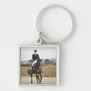 female dressage rider exercising key ring