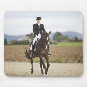 female dressage rider exercising mouse mat