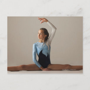 Female gymnast (12-13) performing splits postcard
