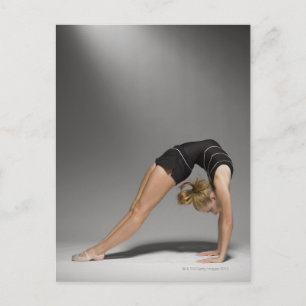 Female gymnast stretching, studio shot 2 postcard