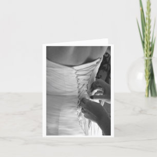 Female hand lacing up wedding dress back card