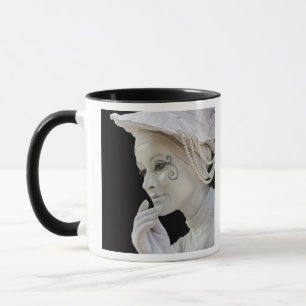 Female mime performing on street corner mug