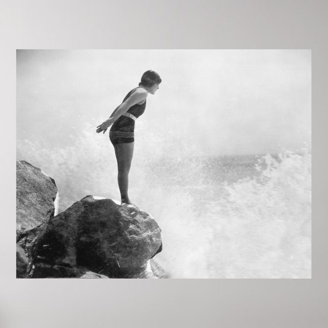 Female swimmer on rock above crashing surfvintage, poster (Front)