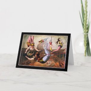 Female trapeze acrobats at circus card