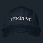Feminist, white text on navy blue embroidered hat<br><div class="desc">Show that you support equal rights for women and men by wearing a baseball cap featuring the word "feminist" embroidered in bold white all capital text on a navy blue background. Hats are available in other colours in the sidebar. To see the design Feminist on other items, click the "Rocklawn...</div>