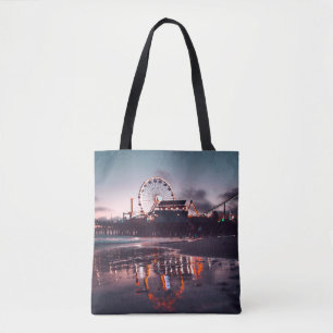 Ferris wheel during golden hour tote bag