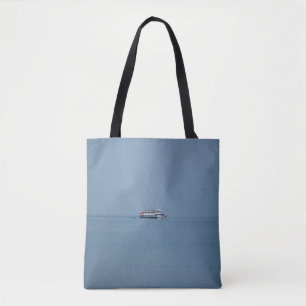 Ferry on a lake Tote Bag