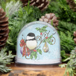 Festive Blue Vintage Christmas Chickadee Snowglobe<br><div class="desc">This charming Christmas illustration features a fluffy black-capped chickadee perched on a decorative holiday branch adorned with holly leaves, bright red berries, and colorful ornaments. Delicate snowflakes scatter across the soft blue winter backdrop, creating a magical seasonal scene. Perfect for bird lovers, nature enthusiasts, and anyone who adores whimsical holiday...</div>