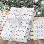 Festive Holiday Christmas String Lights Wrapping Paper<br><div class="desc">Wrap your gifts in cheerful style with this festive Christmas wrapping paper featuring stripes of colourful string lights with playful loops. The string lights repeat in horizontal sections across the design, creating a bright and fun pattern. The "lines" that run through the design are actually just the strings of lights—looping...</div>