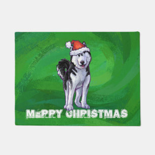 Festive Husky in Santa Hat on Green Doormat