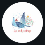 Festive Manta Ray Seas n Greetings Christmas Tree Classic Round Sticker<br><div class="desc">What a delightful gift for the ocean lover. A festive Christmas Manta Ray created in watercolor,  with a cute Santa Hat perched on his head. An underwater Christmas tree is lurking in the background! The  message reads Seas and Greetings in trendy script font,  but this can be easily changed.</div>