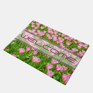 Field of pink tulip flowers doormat