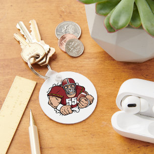 Fierce American Football Player Breaking Through  Key Ring