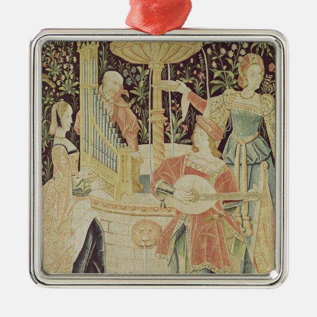 Figures around a fountain metal tree decoration (Front)