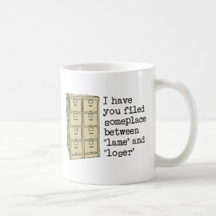 Filed Between Lame and Loser Funny Insult Mug