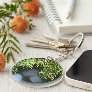 Fir pine needles with bokeh key ring
