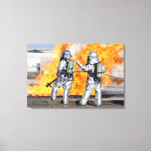 Firefighters battle a simulated fire canvas print