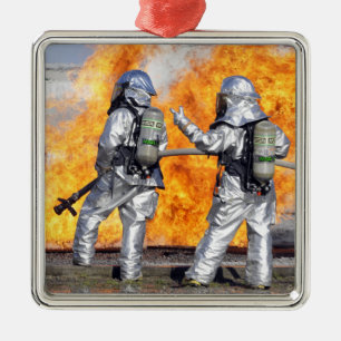 Firefighters battle a simulated fire metal tree decoration