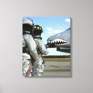 Firefighters deploy a fire hose during a drill canvas print