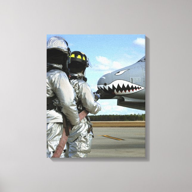 Firefighters deploy a fire hose during a drill canvas print (Front)