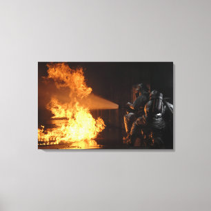 Firefighters extinguish a simulated battery fir canvas print