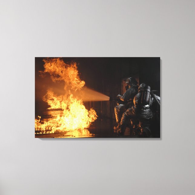 Firefighters extinguish a simulated battery fir canvas print (Front)