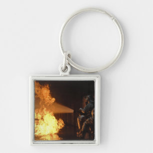 Firefighters extinguish a simulated battery fir key ring