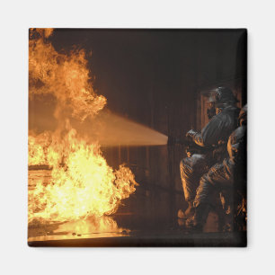 Firefighters extinguish a simulated battery fir magnet