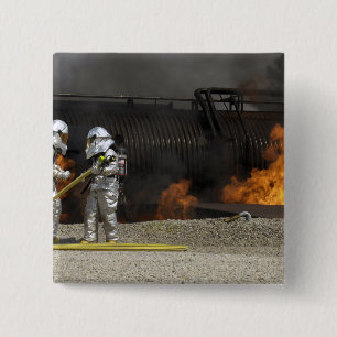 Firefighters neutralise a live fire 15 cm square badge