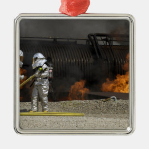 Firefighters neutralise a live fire metal tree decoration