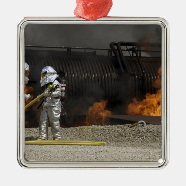 Firefighters neutralise a live fire metal tree decoration (Front)