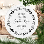 First Christmas Baby Photo Black White Ornament<br><div class="desc">This design features a black and white wreath of Christmas ornaments, holly berries and foliage, surrounding the words "My First Christmas" in whimsical black printing font. Customise the front with baby's name in handwriting script, along with the family name and year. Easily replace the sample photo on the reverse side...</div>