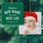 First Christmas baby photo cute green Ceramic Ornament<br><div class="desc">There's a new name on the nice list! Celebrate and remember baby's first Christmas with this cute one-photo personalised ornament. The front features a sweet type treatment on a green background with room for name and birth date and the back has a large photo. This keepsake ornament makes a great...</div>