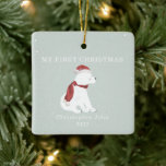 First Christmas Baby Polar Bear Blue Snow Ceramic Ornament<br><div class="desc">Illustration of a baby polar bear cub wearing a santa hat and matching scarf surrounded by snowflakes with a light blue background.  Text says,  "My first Christmas."  Personalise the name and year.</div>