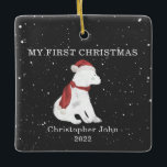 First Christmas Baby Polar Bear Dark Grey Snow Ceramic Ornament<br><div class="desc">Illustration of a baby polar bear cub wearing a santa hat and matching scarf surrounded by snowflakes with a dark grey background.  Text says,  "My first Christmas."  Personalise the name and year.</div>