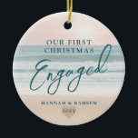 First Christmas Beach Engagement Ocean Pastel Ceramic Tree Decoration<br><div class="desc">Keepsake Engagement Ornament a pastel pink peach and teal blue beach sunset or sunrise over a tropical ocean coastline sand shoreline is perfect for the couple who got engaged on a beach or are planning a destination wedding.</div>