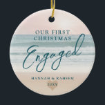 First Christmas Beach Engagement Ocean Pastel Ceramic Tree Decoration<br><div class="desc">Keepsake Engagement Ornament a pastel pink peach and teal blue beach sunset or sunrise over a tropical ocean coastline sand shoreline is perfect for the couple who got engaged on a beach or are planning a destination wedding.</div>