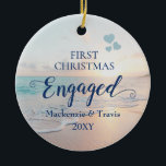First Christmas Engaged Beach Sunset Ceramic Ornam Ceramic Tree Decoration<br><div class="desc">Keepsake Engagement Ornament with a romantic beach sunset or sunrise over a tropical ocean with turquoise teal blue waves and pink peach sand shoreline with beautiful pastel colours is perfect for the couple who got engaged on a beach or are planning a destination wedding.</div>