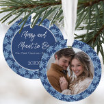 First Christmas Engaged Couples Photo Poinsettia Ornament<br><div class="desc">Commemorate your first Christmas as an engaged couple with this beautiful photo ornament with a classic blue and white hand drawn poinsettia pattern featuring a photo on one side and your text on the back.</div>