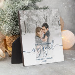 First Christmas Engaged Photo Metallic Blue Script Plaque<br><div class="desc">Commemorate your engagement with this beautiful modern keepsake plaque. The blue text reads "Our first Christmas engaged, " with the word "engaged" in elegant faux foil handwriting script with flourishes before and after. Replace the sample image with your favourite photo, and add your names and the year. A white gradient...</div>